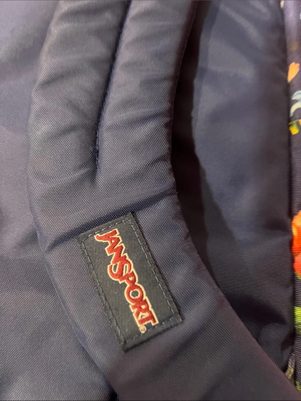 Jansport Navy Backpack with Colorful Floral Print